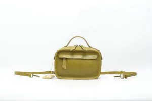 Olive green leather Boston handbag detail view, showing fine stitching, handles and texture.