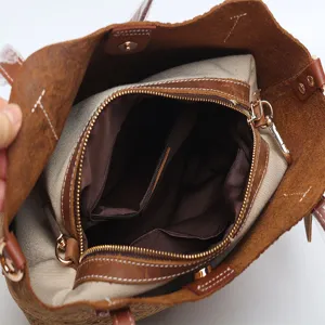 Vintage embossed genuine leather tote bag for women, stylish brown shoulder and handbag.