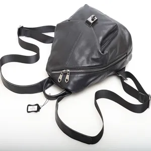 Black genuine leather backpack for women, stylish casual daypack with metal lock.