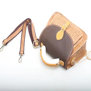 Genuine leather retro crossbody bag for women, featuring embossed pattern and shoulder strap.