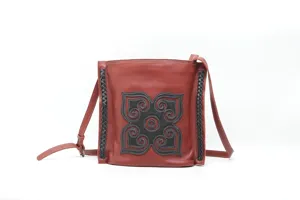 Vintage genuine leather shoulder bag for women, handmade retro crossbody bag with design.