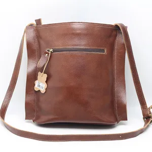 Vintage brown genuine leather shoulder bag for women, retro crossbody square handbag with zipper.