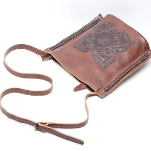 Vintage genuine leather shoulder bag for women, retro crossbody bag with ethnic carved pattern.