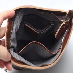 Vintage genuine leather crossbody shoulder bag for women with multiple inner pockets.