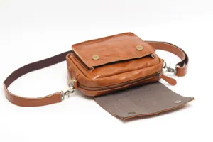 Vintage genuine leather shoulder bag for women, retro brown crossbody bag with flap and zip.