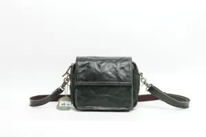 Vintage dark green leather crossbody bag detail view, genuine cowhide square shoulder bag.