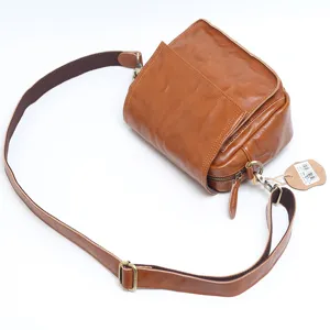 Vintage genuine leather shoulder bag for women, retro brown crossbody bag with adjustable strap.