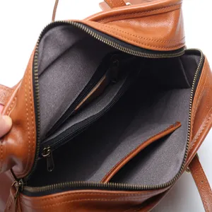 Genuine leather brown tote bag interior view, large capacity handbag with zipper pockets.