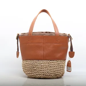 Genuine leather and straw woven bucket bag, stylish handbag with top handles and shoulder strap.
