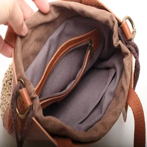 Genuine leather woven bucket bag with interior zipper pocket, stylish handmade shoulder handbag.