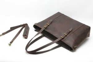 Vintage crazy horse leather tote bag detail with premium hardware and shoulder straps.