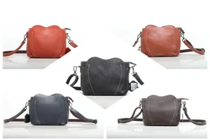 Genuine leather heart-shaped crossbody bag detail view showing fine stitching and colors.