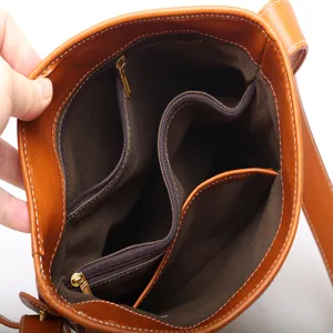 Brown leather bucket bag with multiple zipper compartments, retro style women crossbody bag.