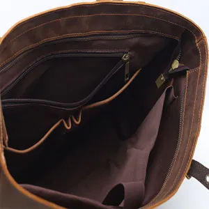 Vintage genuine leather tote bag interior view with large capacity compartments and pockets.