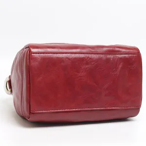 Vintage genuine leather Boston bag for women, stylish tote and crossbody commuting handbag.