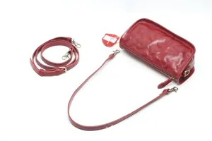 Red leather vintage shoulder bag for women, stylish crossbody bag with adjustable straps.