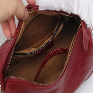 Red genuine leather Boston bag vintage top layer cowhide handbag with interior zipper pocket.