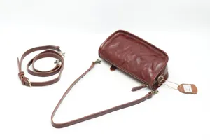 Vintage brown genuine leather shoulder bag with adjustable strap and chic commuter design.