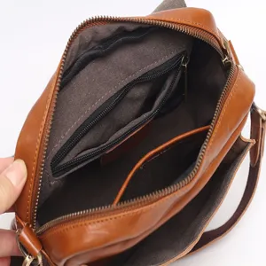 Vintage brown genuine leather women cross body shoulder bag with multi compartments interior.