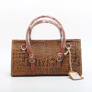 Genuine cowhide retro embossed small handbag, vintage style tote shoulder messenger bag for women.