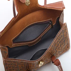Vintage genuine leather women handbag, retro embossed tote shoulder bag for style.