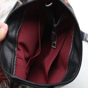 First layer cowhide leather women handbag interior detail view with fabric lining zip pocket