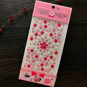 Detailed view of 3D pink flower and pearl jewel stickers for DIY craft decoration