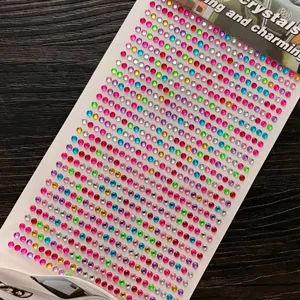 Macro view of multi-colored 3D crystal rhinestone stickers for kids' DIY crafts and decoration.