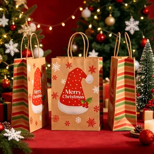 Detail view of Christmas kraft paper gift bags with Santa hat and snowflake patterns