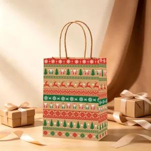 Festive Christmas kraft paper gift bag with reindeer pattern on a wooden table