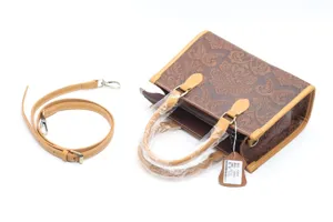 Sac à main vintage en cuir pour femmes, élégant sac porté épaule rétro avec bandoulière.