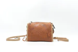 Vintage genuine leather shoulder crossbody bag with embossed floral pattern for women.