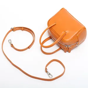 Genuine leather shoulder bag for women, stylish small square crossbody handbag with strap.
