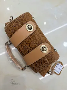 Vintage embossed genuine leather handbag, retro cowhide shoulder cross body bag with metal locks.