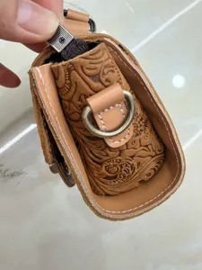 Detailed view of genuine leather embossed vintage handbag craft craftsmanship quality shoulder bag.