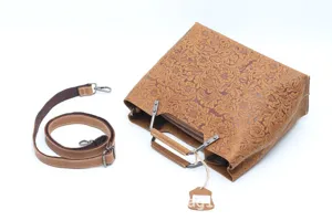 Vintage genuine leather handbag with floral embossing, detachable strap, and stylish metal handles.