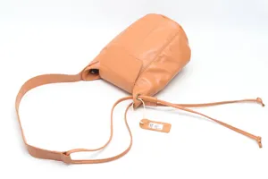 Classic leather bucket bag for women, stylish brown shoulder bag with adjustable strap.