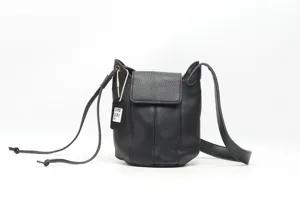 Black genuine leather bucket shoulder bag detail, featuring flap closure and adjustable strap.