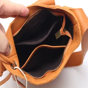 Genuine leather bucket shoulder bag for women, stylish commuting handbag with spacious interior.