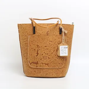 Genuine leather bucket bag for women, vintage embossed tote handbag with top handle and front pocket.