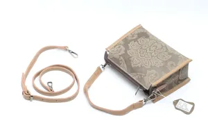 Vintage genuine leather top layer cowhide handbag with retro floral embossed design.