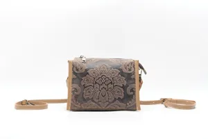 Vintage genuine leather shoulder crossbody bag with elegant embossed floral design, retro style.