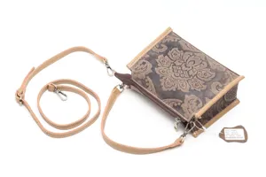 Detailed view of retro embossed genuine leather crossbody bag with adjustable fine strap.