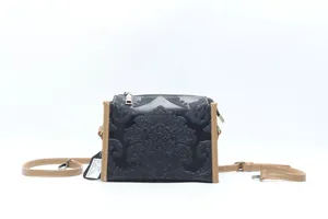 Retro embossed genuine leather crossbody bag with brown trim, stylish women shoulder bag.