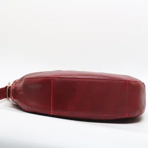 Elegant red leather shoulder bag for women, stylish crossbody handbag with premium texture.