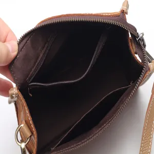 Vintage genuine leather crossbody shoulder bag for women, retro brown handbag interior view.