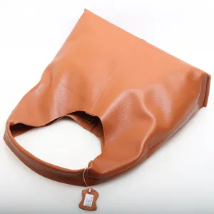 Classic brown genuine leather hobo bag for women, stylish minimalist commuter shoulder tote.