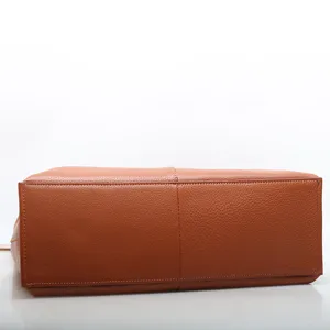 Brown genuine leather tote bag bottom view, classic casual handbag for women daily commuting.