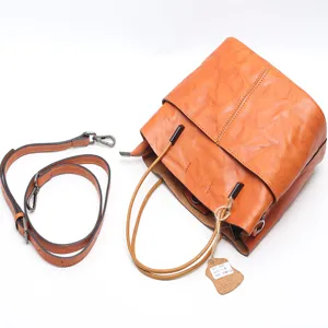 Vintage leather bucket bag for women, vegetable tanned cowhide shoulder crossbody main view.