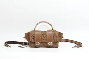 Brown embossed genuine leather top handle shoulder crossbody bag with double turn locks.
